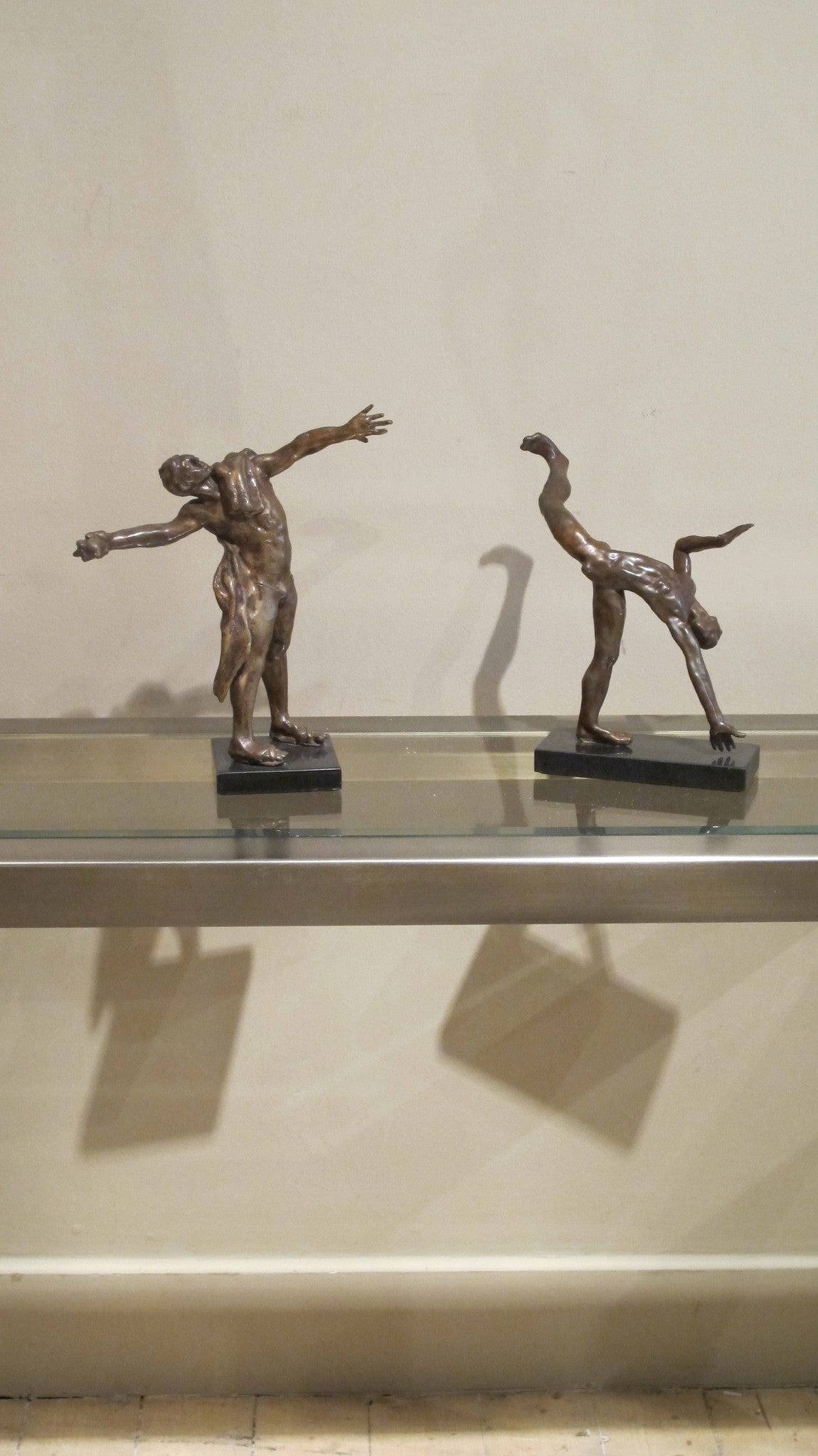 A pair of bronze studies of  male performers by J.W. Mills PPRBS ARCA FRSA dated 76
