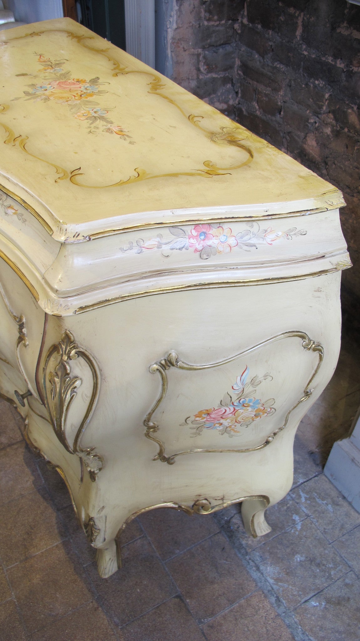Bombe fronted italian commode circa 1950 with hand painted decoration.