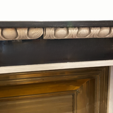 Striking French mid century fireplace flanked by two greyhounds.