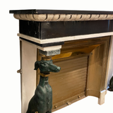 Striking French mid century fireplace flanked by two greyhounds.