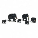 Group of early twentieth century Ebony elephants with bone details.
