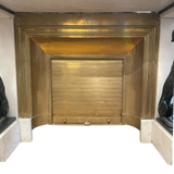 Striking French mid century fireplace flanked by two greyhounds.