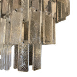 Large and unusual 1970's Murano chandelier with tiered glass and metal drops.