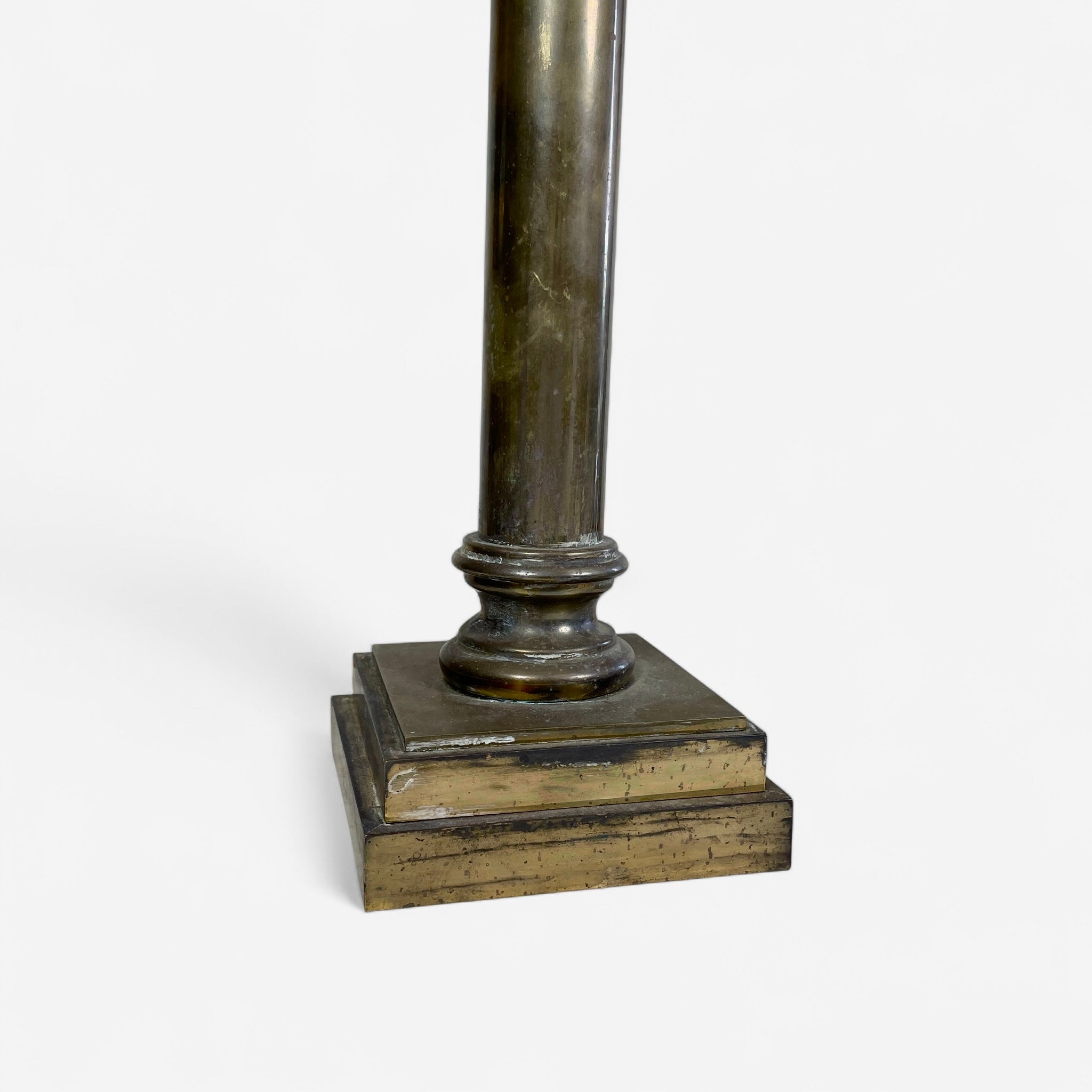 Classical pair of brass table lamps with tapered white glass shades.