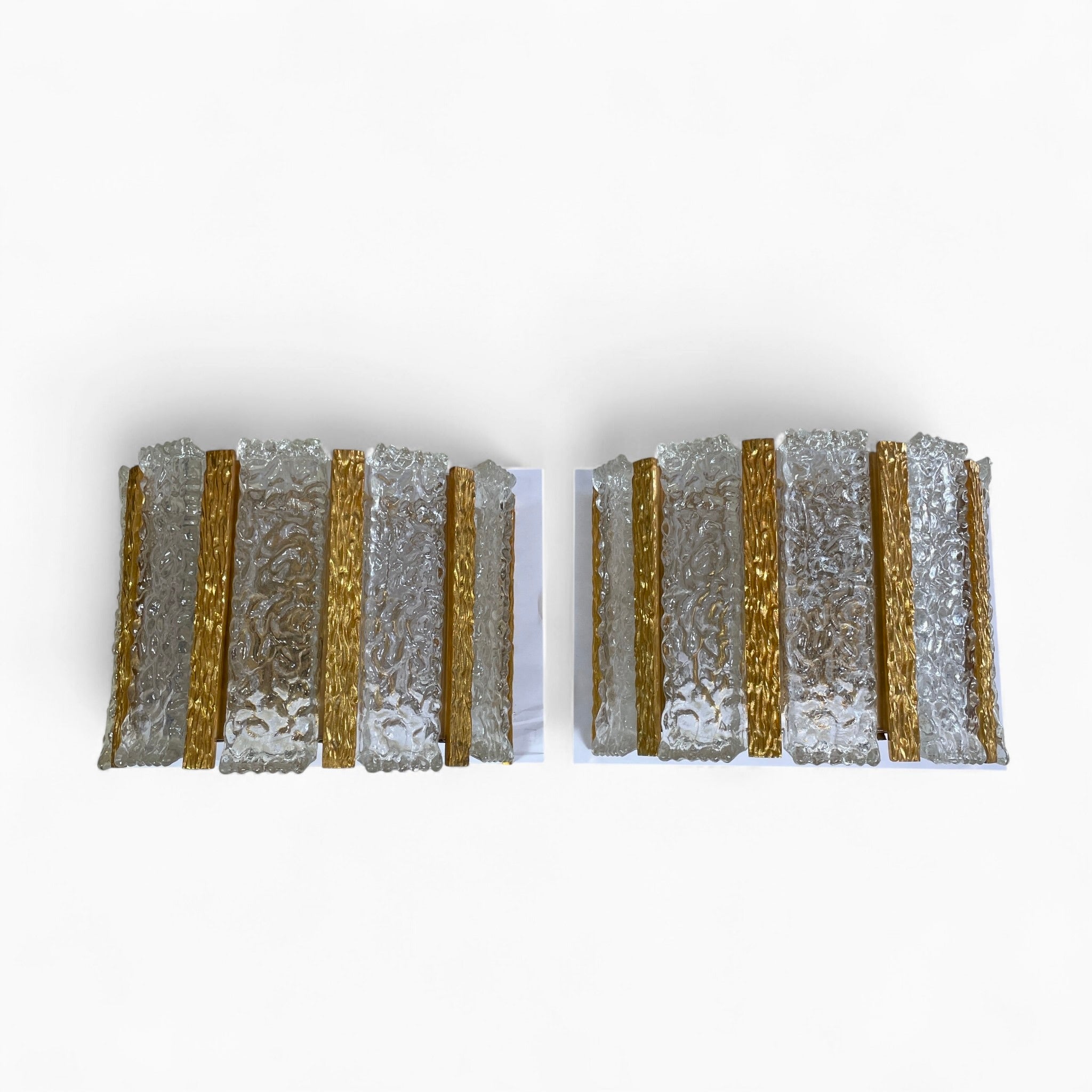 Decorative pair of 1970's gilt metal and glass wall lights .