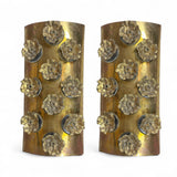 Large pair of decorative brass wall lights with Murano glass disks and bronze flowers .
