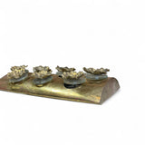 Large pair of decorative brass wall lights with Murano glass disks and bronze flowers .