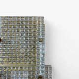 Large Murano glass and brass wall lamps in the brutalist style.