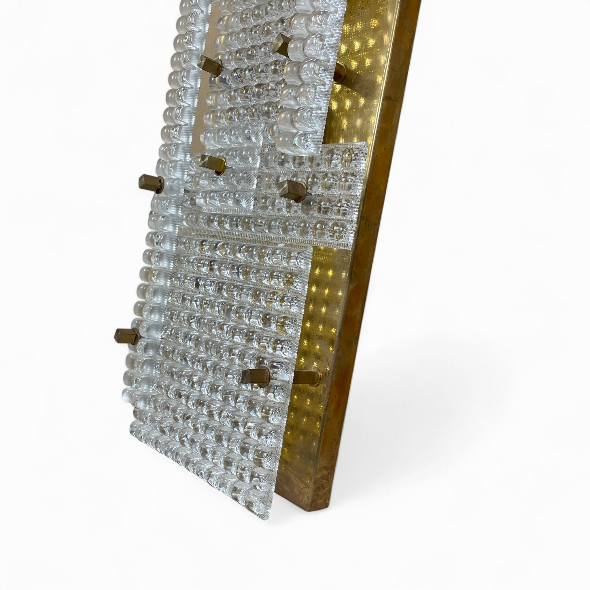 Large Murano glass and brass wall lamps in the brutalist style.