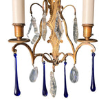 Decorative pair of bronze french wall lights with crystal and cobalt blue glass drops.
