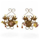 pair of gilt metal wall lights with enamelled roses and amber drops.