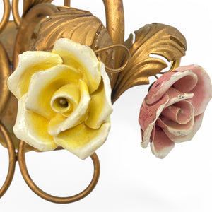 pair of gilt metal wall lights with enamelled roses and amber drops.
