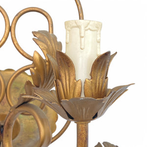 pair of gilt metal wall lights with enamelled roses and amber drops.