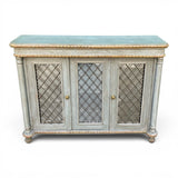 Decorative antique sideboard with mirrored doors and parcel gilt finnish.