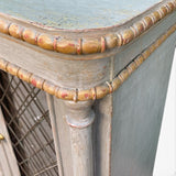 Decorative antique sideboard with mirrored doors and parcel gilt finnish.