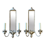 Pair of decorative silver gilt and carved wood wall light with mirror panel.