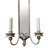 Pair of decorative silver gilt and carved wood wall light with mirror panel.