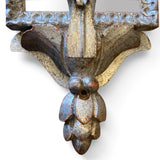 Pair of decorative silver gilt and carved wood wall light with mirror panel.