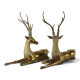 Large pair of mid century solid brass recumbent deer.