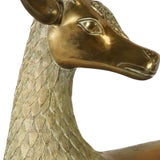 Large pair of mid century solid brass recumbent deer.