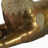 Large pair of mid century solid brass recumbent deer.