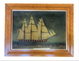 Reverse glass maritime image of the U.S.S Constitution in maple frame.