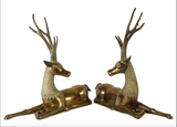 Large pair of mid century solid brass recumbent deer.