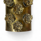 Large pair of decorative brass wall lights with Murano glass disks and bronze flowers .