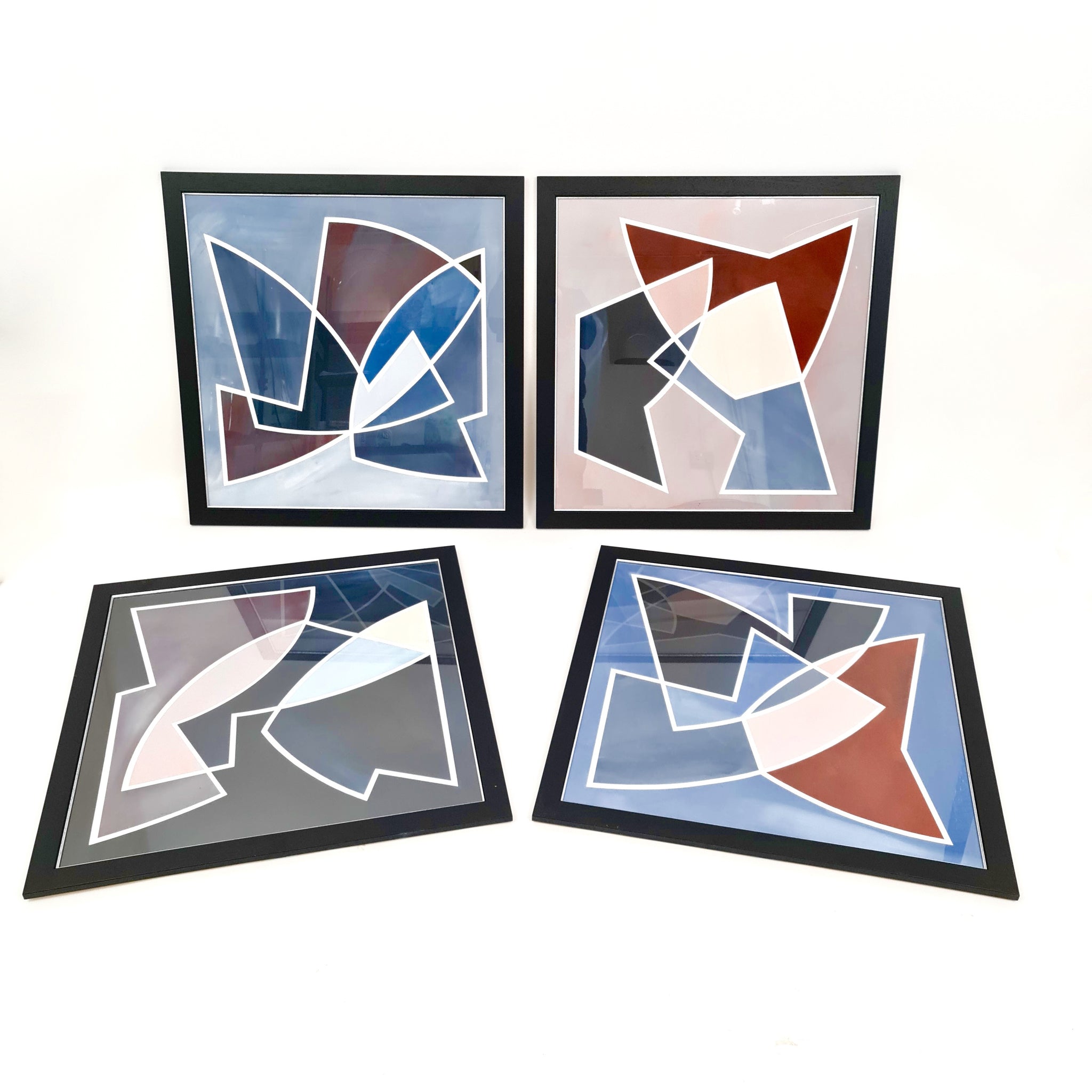 Very decorative set of four geometric paper artworks.