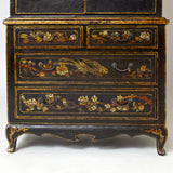 Charming dwarf cabinet with naturalistic decorations and gilt details.
