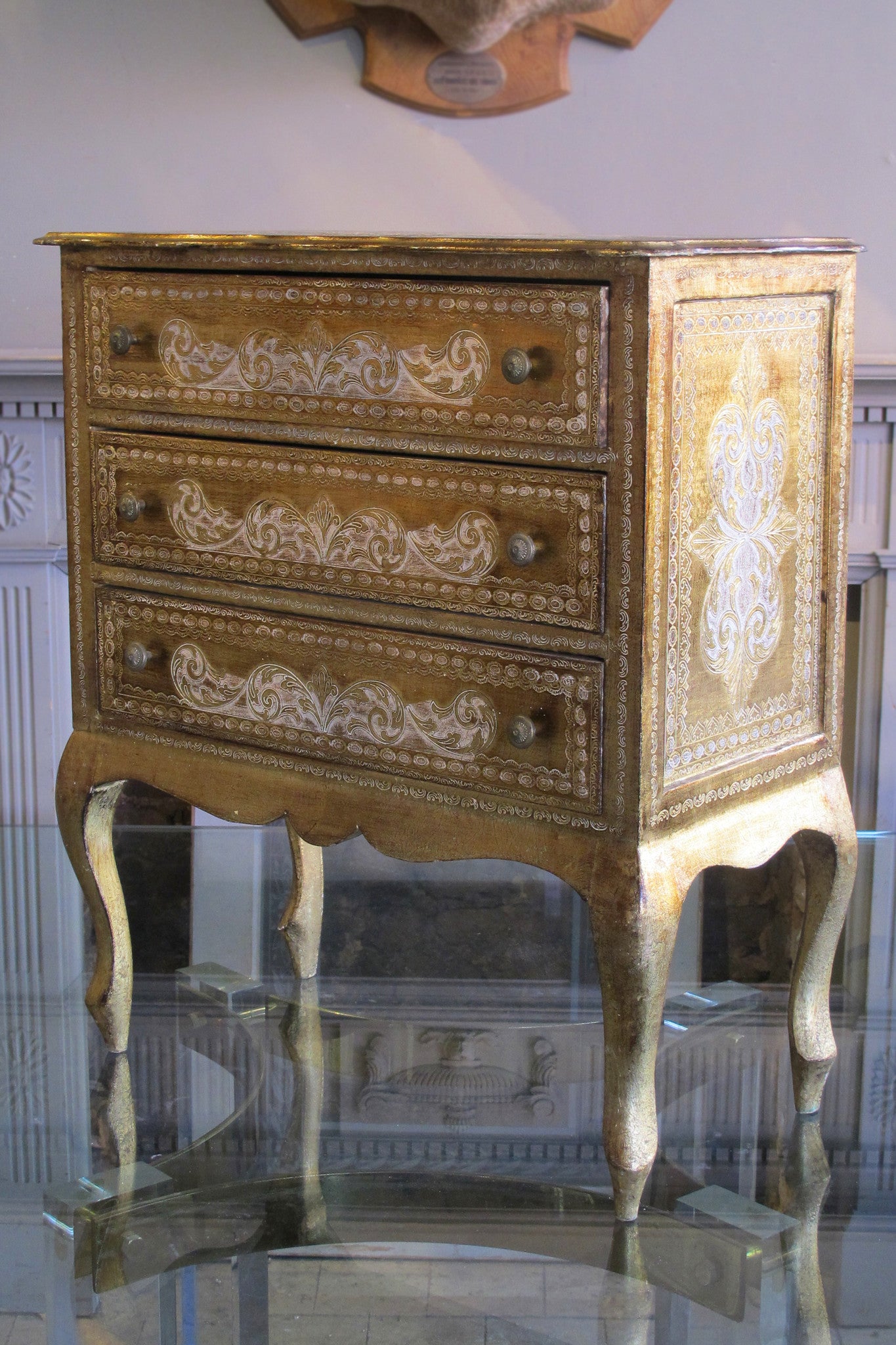 X Gilt chest of drawers.