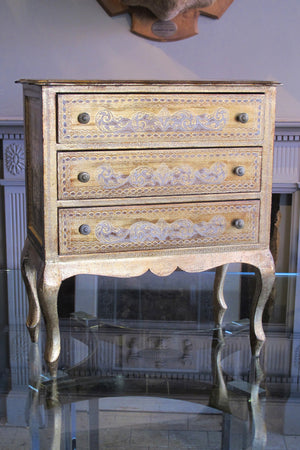 X Gilt chest of drawers.