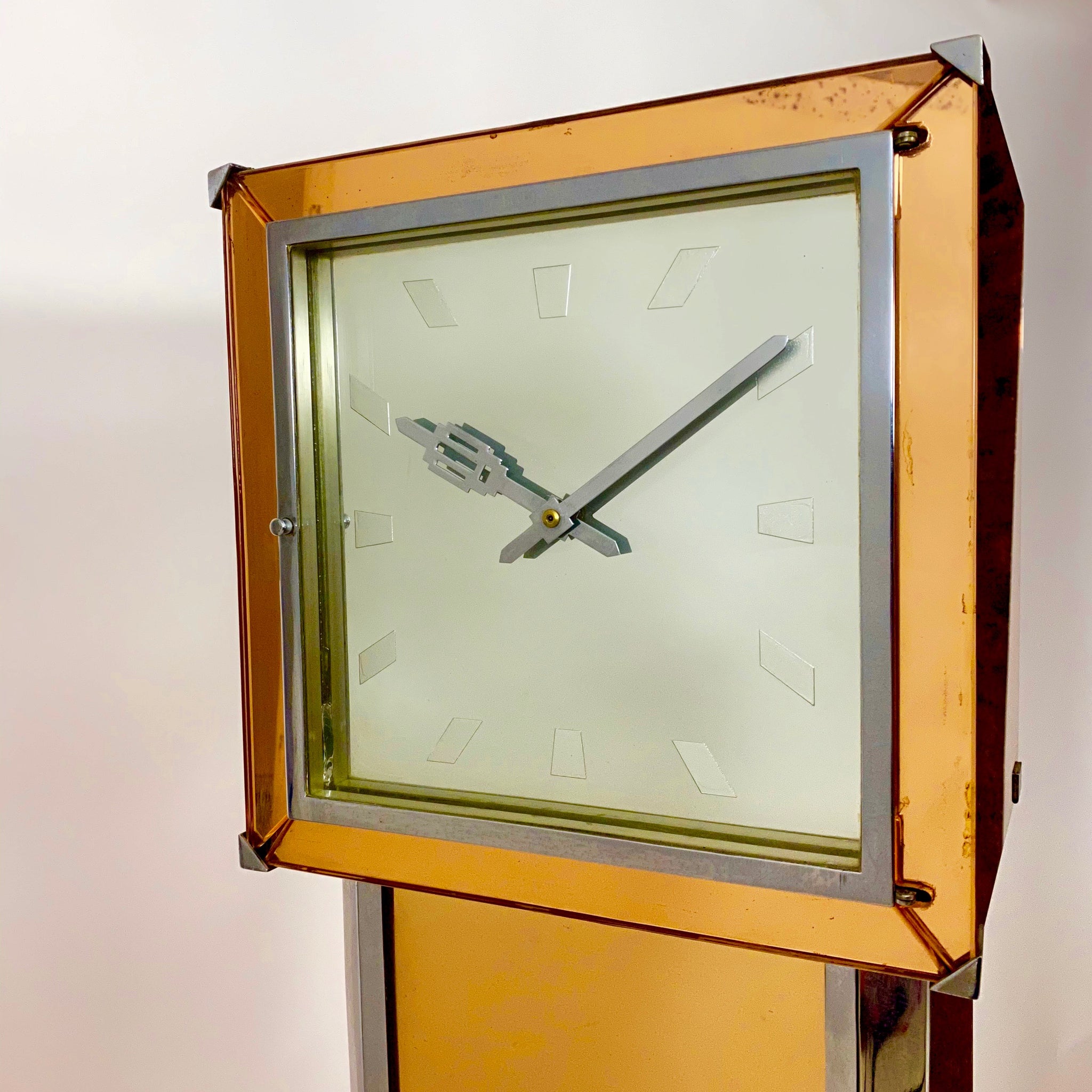 A mirrored Art Deco cocktail cabinet modelled as a long case clock .