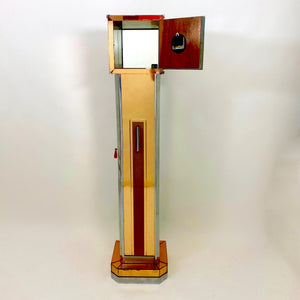 A mirrored Art Deco cocktail cabinet modelled as a long case clock .