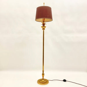Gilt metal floor lamp in the style of Maison Charles.