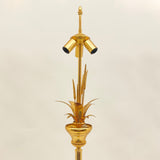 Gilt metal floor lamp in the style of Maison Charles.