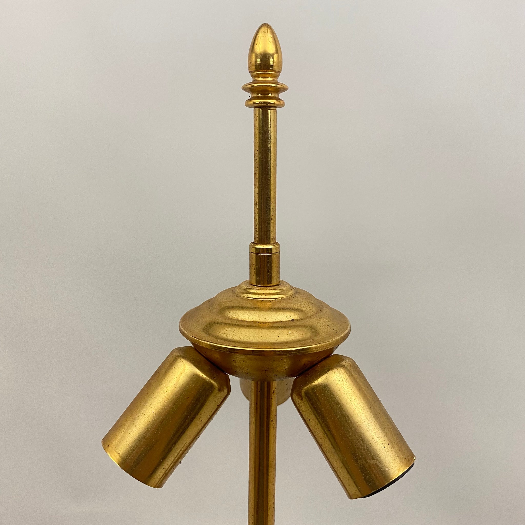Gilt metal floor lamp in the style of Maison Charles.