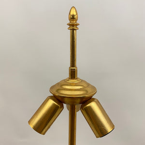 Gilt metal floor lamp in the style of Maison Charles.