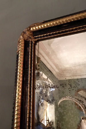 X 19th century french mirror with part gilt and ebonised frame with original distressed mirror.