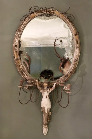 X A 19th century oval highly distressed 'Miss Haversham" style mirror.