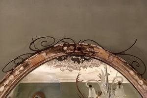 X A 19th century oval highly distressed 'Miss Haversham" style mirror.