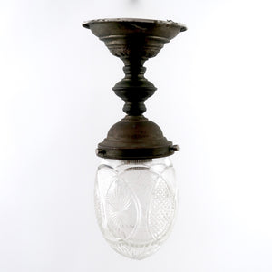 Decorative english bronze hanging light with cut glass shade .