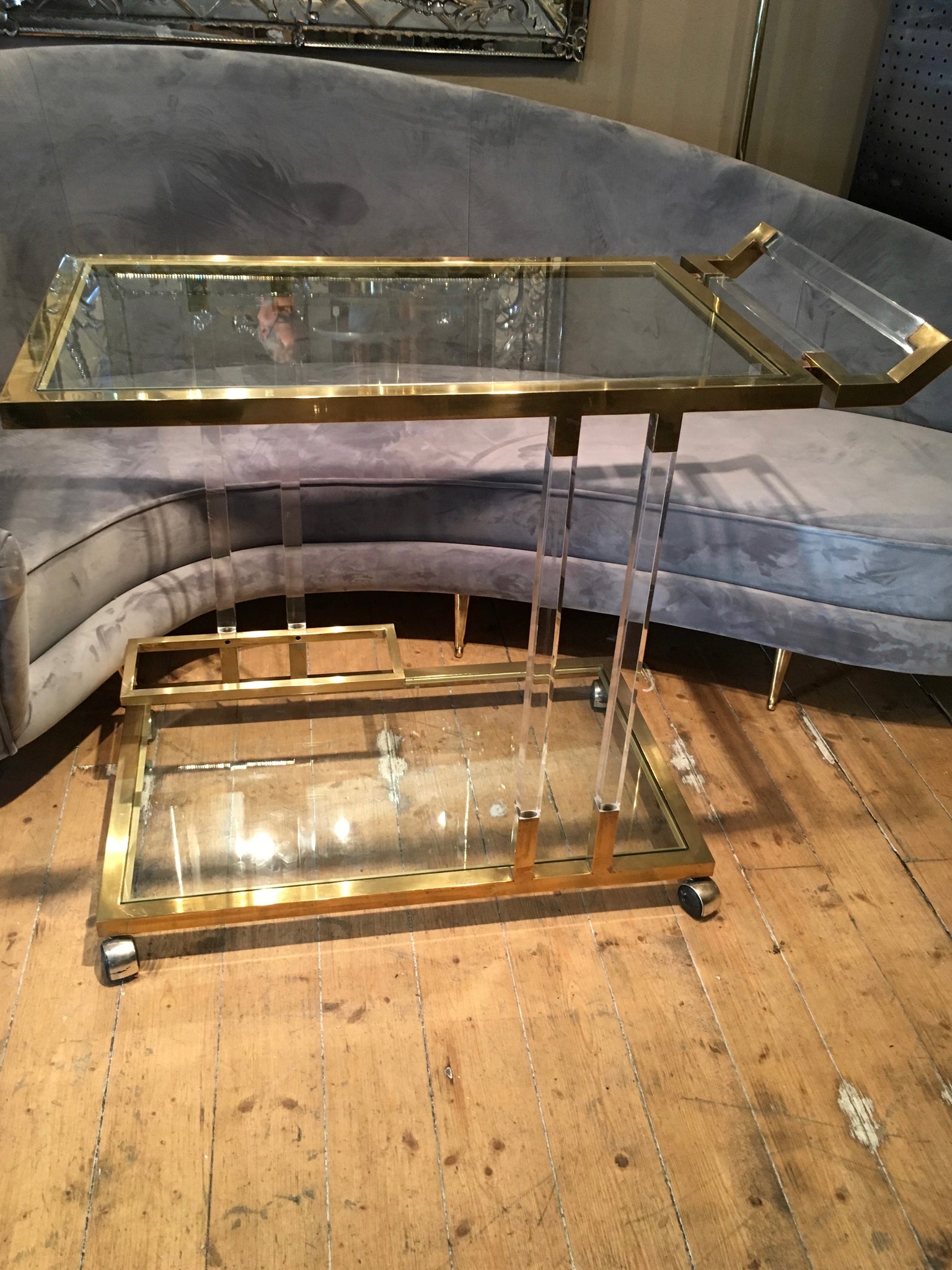 Chique and fabulous 1970's lucite and brass Bar trolley .