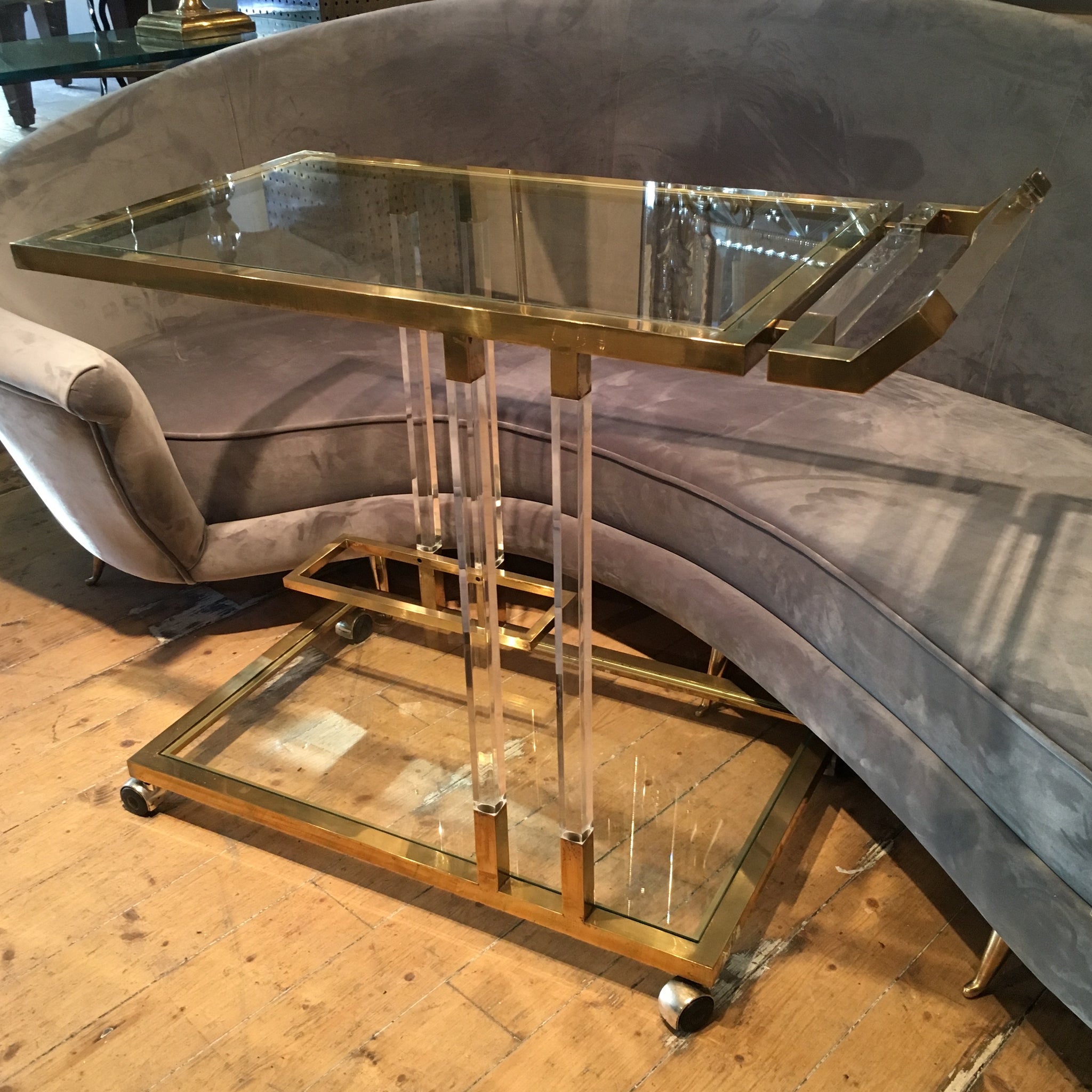 Chique and fabulous 1970's lucite and brass Bar trolley .