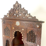 Highly decorative early 20th century corner cabinet.