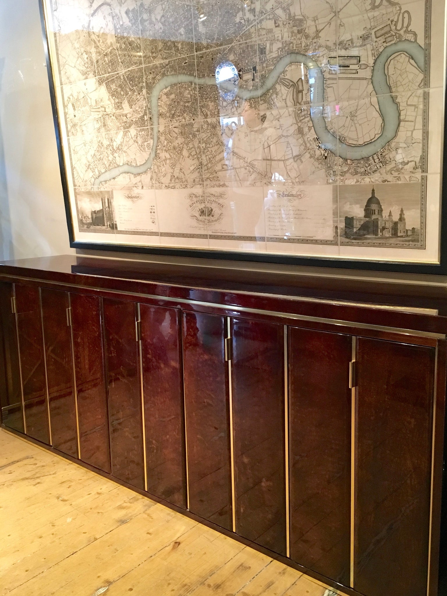 Highly decorative lacquered goatskin sideboard with polished brass details . Italian circa 1970.