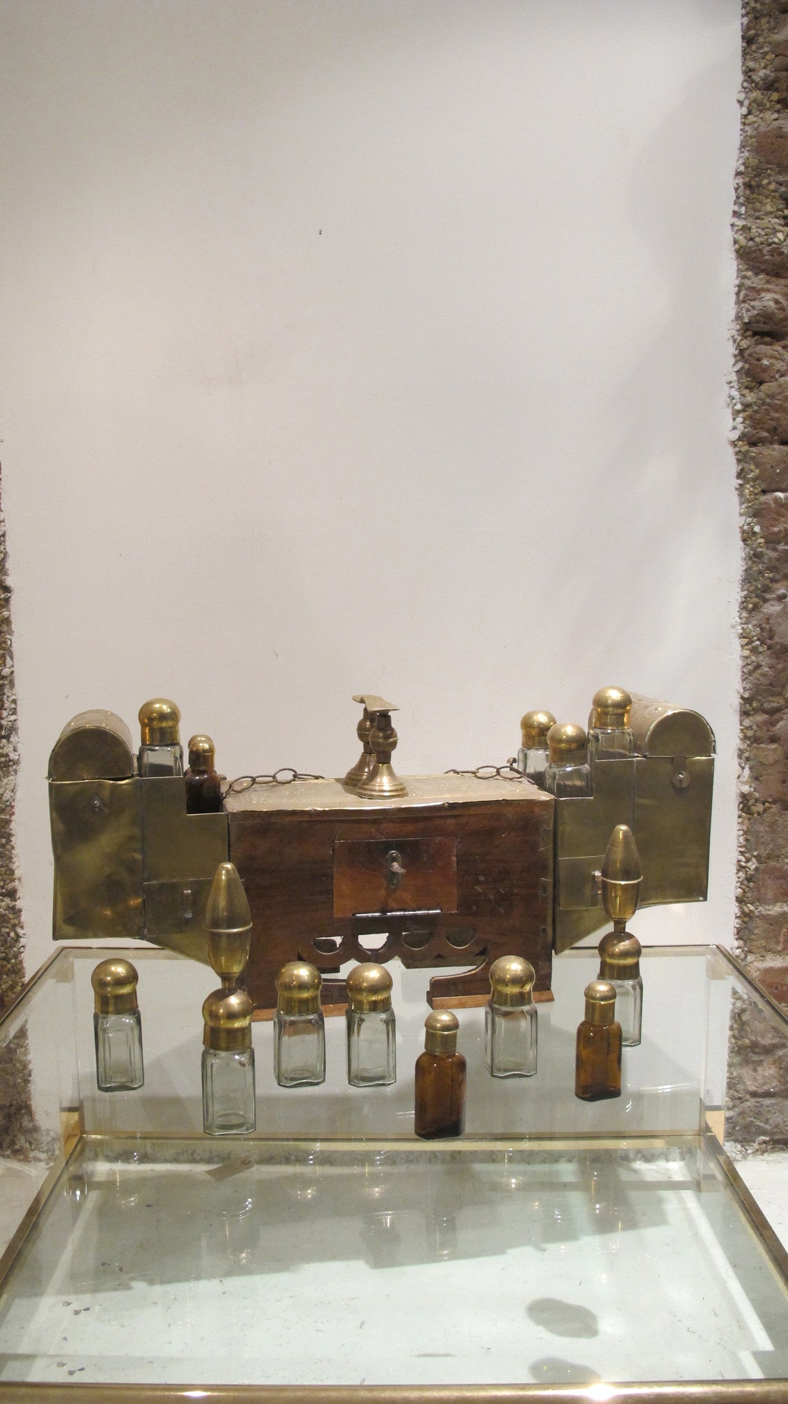 X A highly decorative brass Turkish street shoe shine set with original bottles.