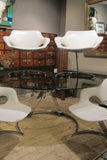 X Boris Tabacoff cantileverd  Glass  top Table with four matching chairs.
