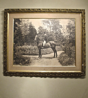X A large photographic image of a huntsman on horseback in gilt frame. Early twentieth century.
