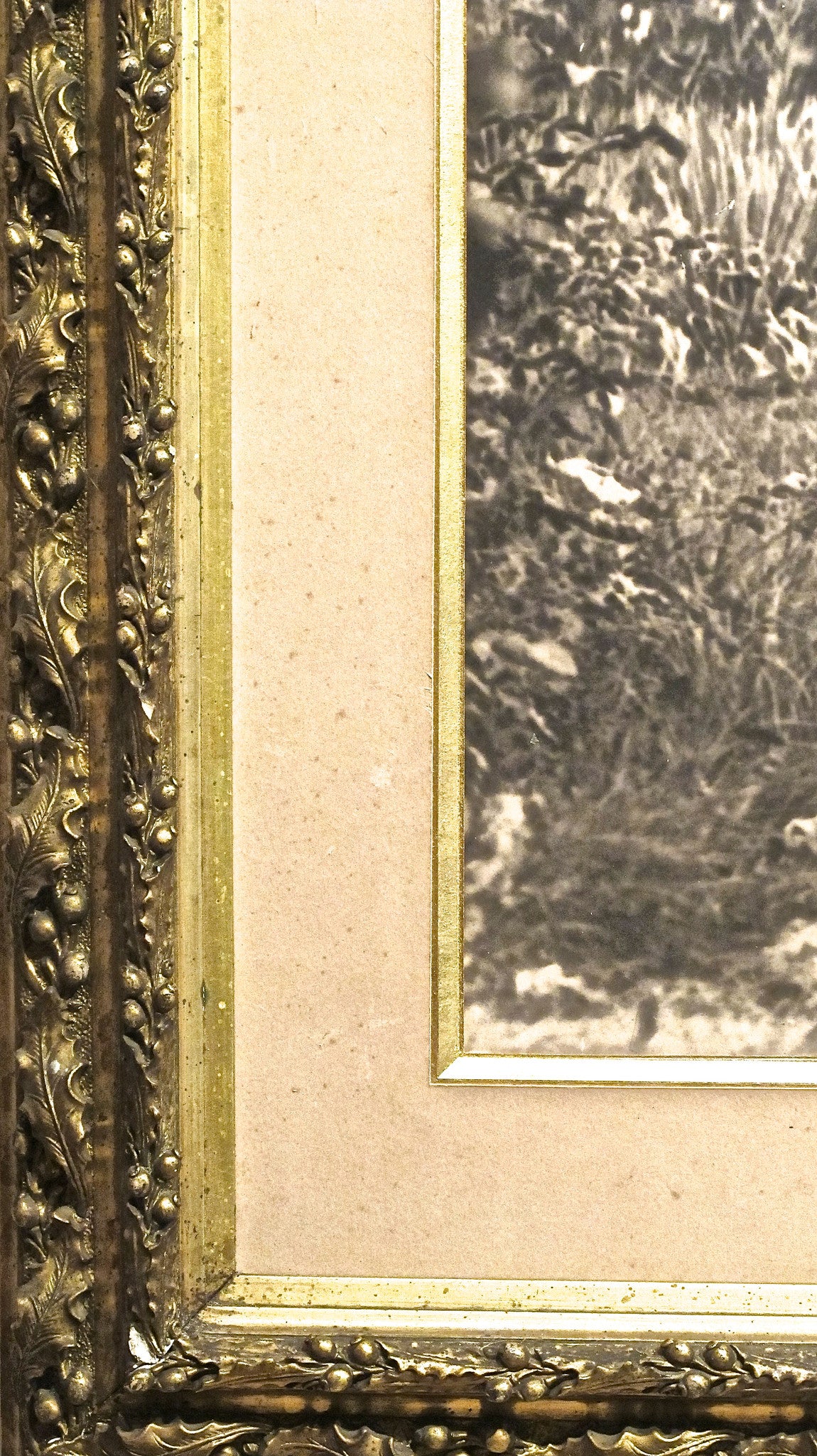 X A large photographic image of a huntsman on horseback in gilt frame. Early twentieth century.